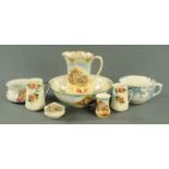 A Falcon Ware wash jug and bowl set, each with printed coaching scene decoration,