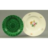 A 19th century Vienna porcelain floral decorated plate, and a Wedgwood leaf moulded plate.