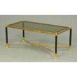 A rectangular brass coffee table, with smoked glass top. 106 cm x 51 cm.