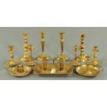 Four pairs of brass candlesticks, twin chamber stick and two further chambersticks. Tallest 22.