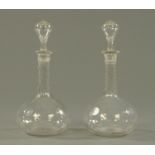 A pair of globe and shaft glass decanters, early 20th century,