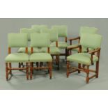 A set of two carver arm and six single oak dining chairs, with upholstered backs,