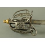 A Victorian Scottish basket hilt officers sword with etched double fullered blade,