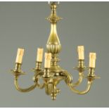 A brass five branch centre ceiling light fitting. Height +/- 50 cm, width +/- 45 cm.