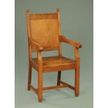 An oak Wainscot style chair, reproduction, with panelled back,