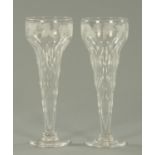 A pair of 19th century banqueting goblets, etched with fruiting vine and faceted. Height 31 cm.