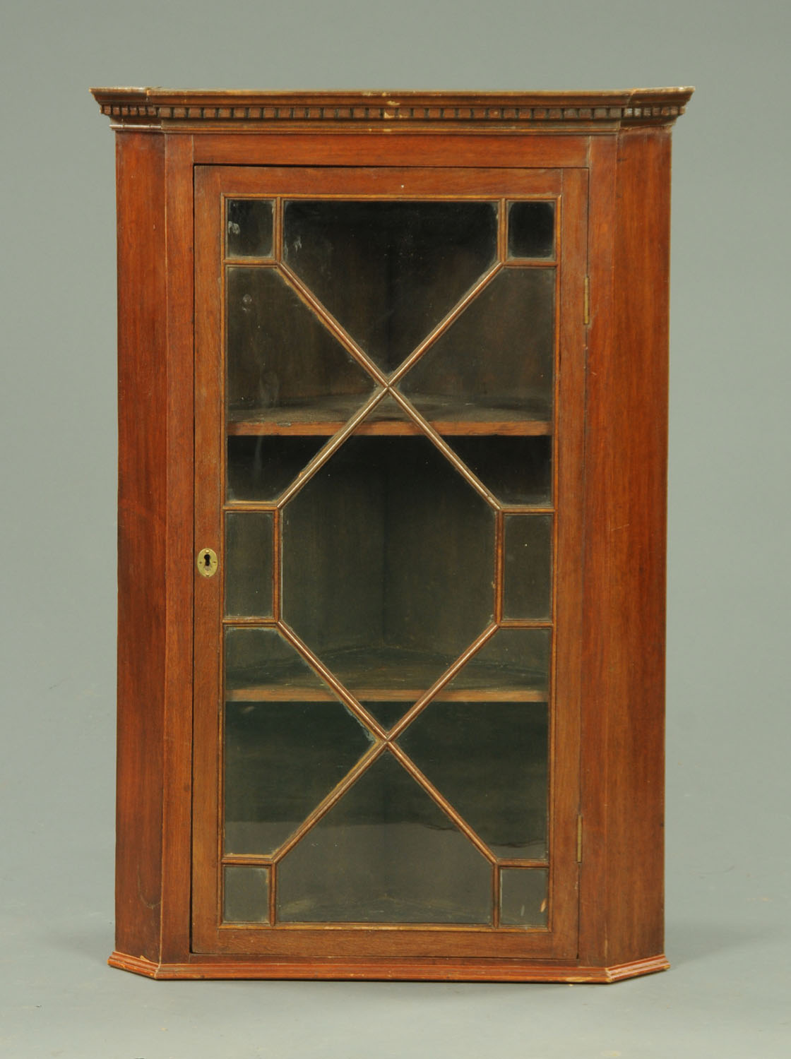 A 19th century mahogany hanging corner cupboard,