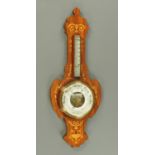 An Edwardian inlaid rosewood Art Nouveau aneroid barometer, height 86 cm.