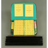 A Mah-jong set, mid 20th century in tan leatherette carry case and with four ebonised trays.