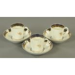 Three late 18th/early 19th century cups and saucers, with moulded bodies, probably Worcester.