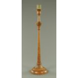 A large pricket type candle stand, turned, wooden. Height 91 cm.