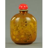A large Chinese amber glass interior painted snuff bottle, 20th century,