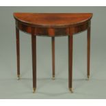 An Edwardian mahogany turnover top card table, demi-lune,