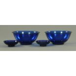 A pair of blue Peking glass finger bowls and a matching pair of sauce bowls,