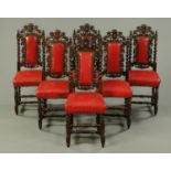 A set of six Victorian oak dining chairs, with carved cresting rails,