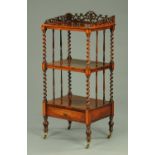 A Victorian rosewood whatnot stand, with fretwork gallery, twist turned supports,