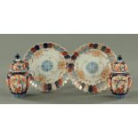 A pair of Japanese Imari plates, circa 1900 and a pair of Japanese Imari vases and covers,