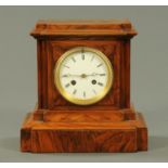 A Victorian walnut cased mantle clock, with two-train striking movement. Height 26 cm, width 26 cm.