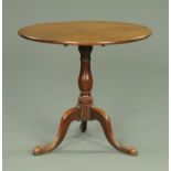 A George III oak tripod occasional table, with snap action,