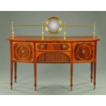 A George III inlaid mahogany bowfronted sideboard, with brass gallery with centre mirror,