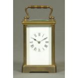 An Edwardian brass carriage clock, French, timepiece only. Height excluding carrying handle 11.