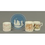 A blue Jasperware Four Seasons plaque, and three commemorative mugs.