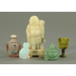 A small Chinese bowenite goblet, height 6 cm, a soapstone figure of a deity, a snuff bottle,