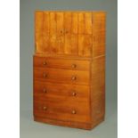 A Heals walnut inverted bowfront cupboard on chest,