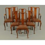 A set of eight walnut Queen Anne style dining chairs, two arm and six single,