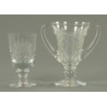 A Wedgwood Queen Elizabeth Silver Jubilee goblet, and an etched Coronation two handled goblet.