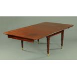 A William IV mahogany dining table, with one full and two half leaves,