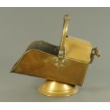 A Victorian brass coal helmet, with loop handle.