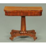 An early 19th century mahogany and rosewood banded turnover top games table, with faceted column,