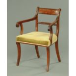 A Regency mahogany armchair, with bowed top rail, shaped arms,