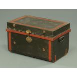 An antique tin trunk, with original paintwork. Width 63 cm.