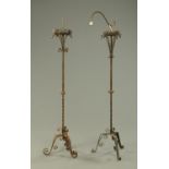 Two wrought iron lamp standards.