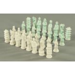 A Chinese porcelain chess set, green and white. Pawn height 9 cm.