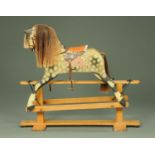 A Haddon trestle rocking horse, Serial No. 227, with real hair mane and tail, bearing plaque.