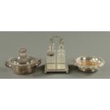 A four bottle condiment set on plated stand,