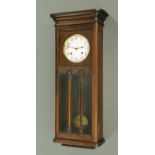 An Ansonia wall clock, large form, with two-train striking movement and with moulded cornice.