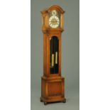 An oak longcase clock, circa 1930, with St.