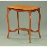 An Edwardian mahogany occasional table, shaped outline. Width 68 cm.