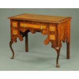 A 1930's walnut side table,