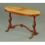 A Victorian mahogany stretcher table, with well figured top, moulded edge, pierced side supports,