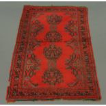 An early 20th century turkey patterned carpet, with fringed ends. 286 cm x 186 cm.