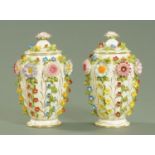 A pair of Coalport floral encrusted vases and covers, 20th century,