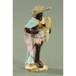 A Meissen figure emblematic of Africa, late 19th century, blue crossed swords mark,