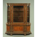 A Victorian oak side cabinet, with rounded corners and foliate carved frieze,