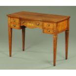 An Edwardian inlaid mahogany kneehole desk, with bowed front,