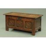 An 18th century oak coffer of small proportions, with three panelled top,